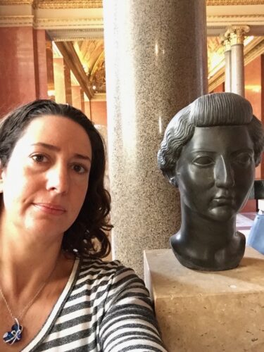 Kate Dimitrova with sculpture of woman's head