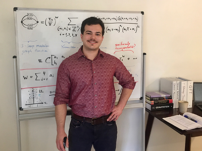 Nick Geiser in front of a white board